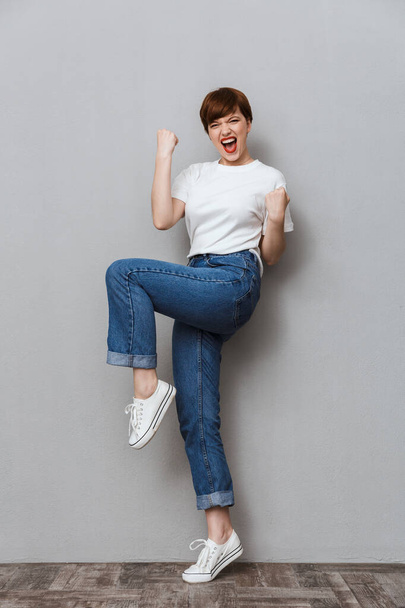 Full length image of attractive woman screaming and gesturing as - Foto, Bild