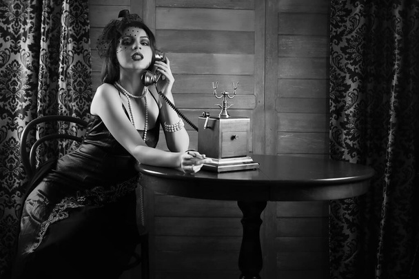 Beautiful 1930s girl smokes monochrome - Photo, Image