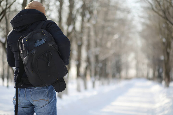 A man with a backpack frosty winter - 写真・画像