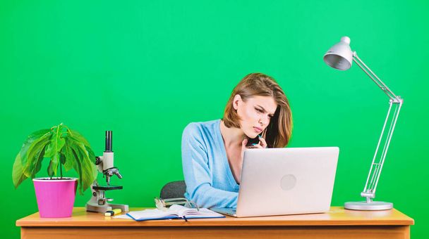 Close-up on discussion. woman with microscope. woman work in office at laptop. businesswoman talking on phone. secretary use mobile phone at workplace. data and information. Business communication - Photo, Image