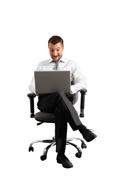 smiley amazed businessman looking at laptop - Photo, Image