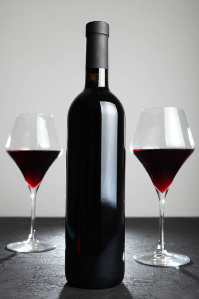 Cabernet red wine in a glass bottle. - Photo, Image