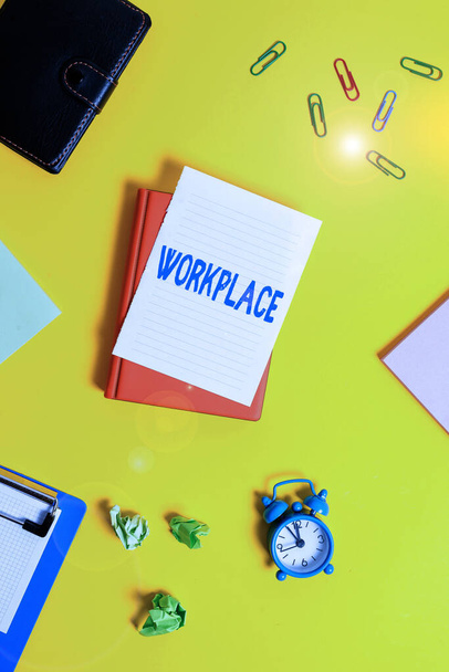 Text sign showing Workplace. Conceptual photo Area where you can find busy showing doing their job orders Pile of empty papers with copy space on the table. - Photo, Image