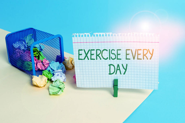 Text sign showing Exercise Every Day. Conceptual photo move body energetically in order to get fit and healthy Trash bin crumpled paper clothespin empty reminder office supplies tipped. - Photo, Image