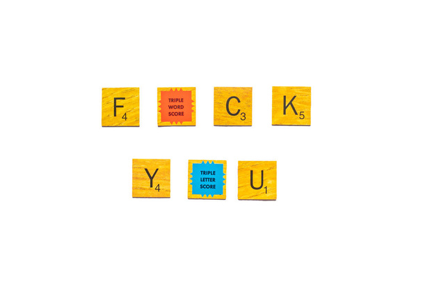 Word of FUCK YOU on wooden texture scrabble letters isolated on white background with clipping path - Φωτογραφία, εικόνα