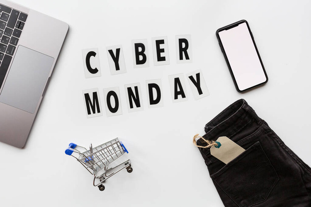 Creative promotion composition Cyber monday text and laptop on white background. Flat lay, top view, overhead, mockup, template. Minimal abstract background. Online shopping, sale, promo. Web banner - Fotó, kép
