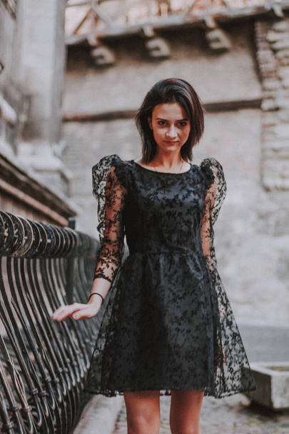 Black-haired girl. Black lace dress. Model shooting. Fashion and - Zdjęcie, obraz
