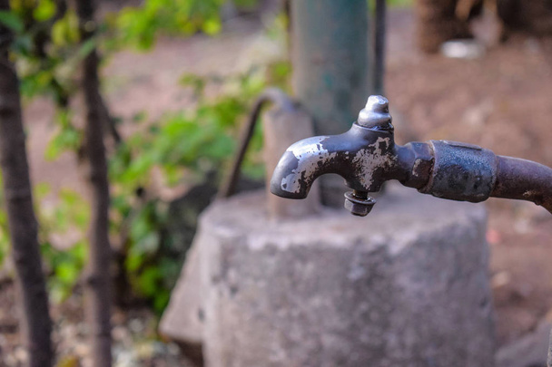 old ruined water tap in the village in India - Photo, Image
