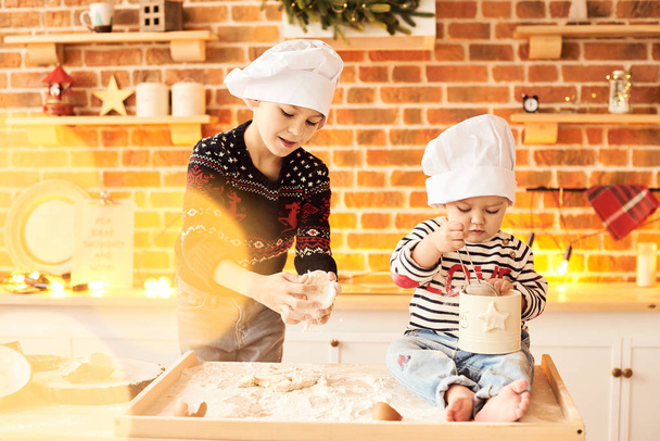 Children are cooked and played with flour and dough in the kitch - Фото, зображення