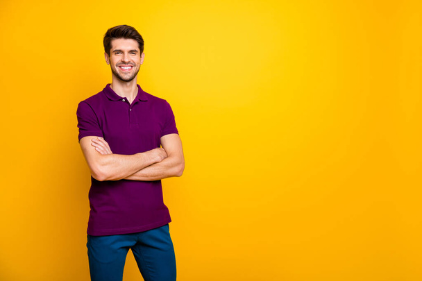 Portrait of his he nice attractive cheerful cheery content brown-haired guy folded arms copy space isolated over bright vivid shine vibrant yellow color background - Foto, immagini
