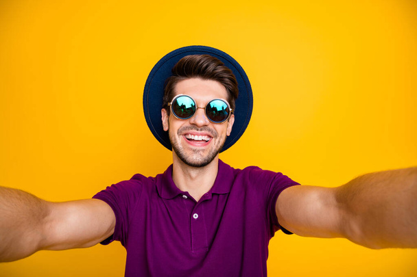 Self-portrait of his he nice attractive glad positive cheerful cheery content brunette guy having fun time isolated over bright vivid shine vibrant yellow color background - Photo, image