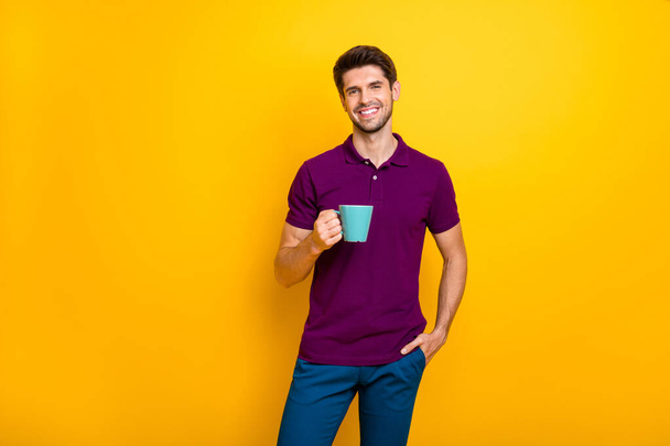 Portrait of his he nice attractive cheerful cheery content guy drinking espresso spending good morning day isolated over bright vivid shine vibrant yellow color background - Foto, Imagen