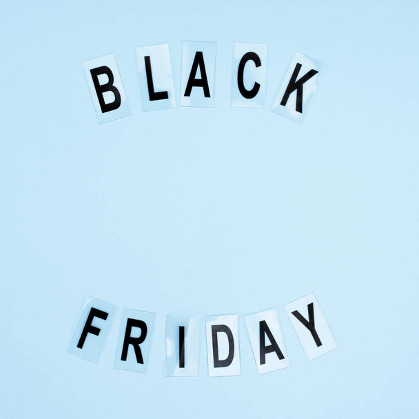 Flat lay with the inscription black friday on a blue background.  - Foto, Imagem