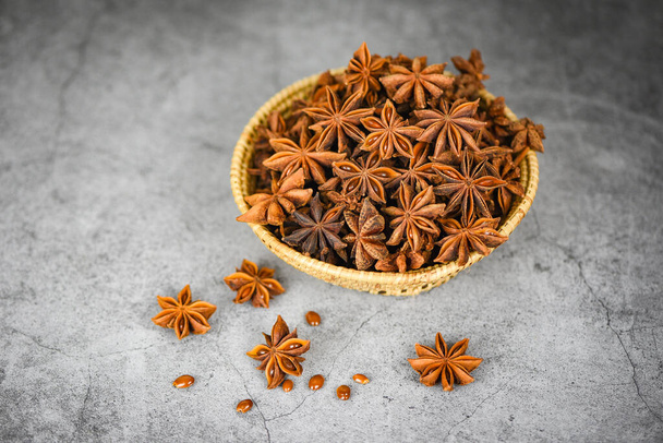Star Anise in basket on dark background herbs and spices for coo - Фото, зображення