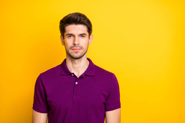Photo of confident serious man staring at you candidly in wait of your telling him needed information isolated over vivid color background - Foto, imagen