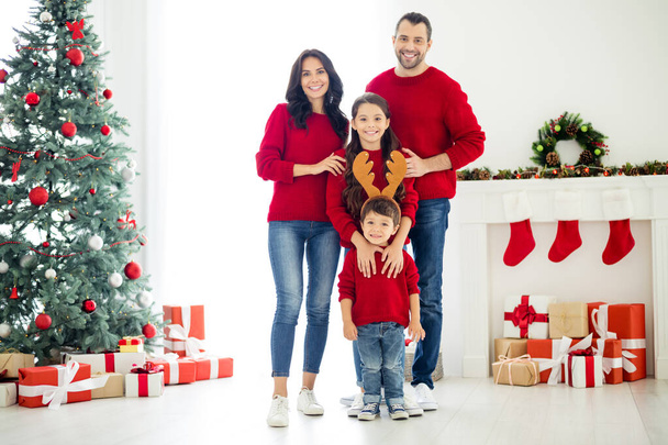 Full length body size view of four nice attractive lovely charming cheerful cheery positive idyllic big adopted foster family spending winter December in light white interior living-room indoors - Foto, Imagem
