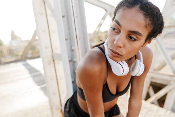 Photo of african american beautiful woman resting while working out - Photo, image