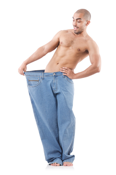 muž v dietě koncept s nadrozměrných džíny - Fotografie, Obrázek