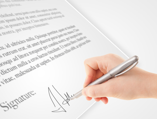 Hand writing personal signature on a paper form - Photo, Image