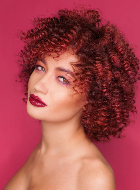 Beautiful model girl with  curly hair . Care products ,hair coloring - Fotó, kép