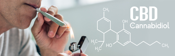 vista recortada del hombre iluminando contundente con cannabis medicinal, tiro panorámico con ilustración de molécula de cbd
 - Foto, Imagen