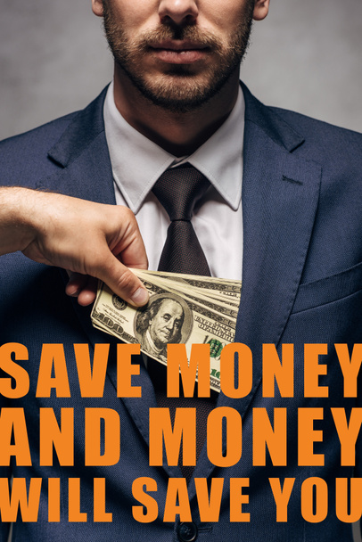 cropped view of man putting money in pocket of businessman with save the money and money will save you illustration - Фото, изображение