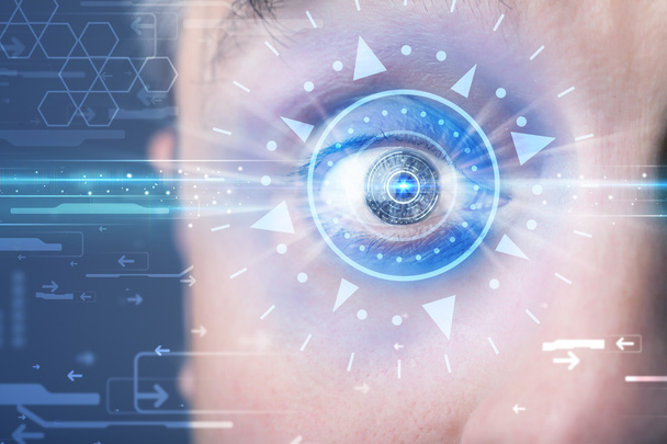 Cyber man with technolgy eye looking into blue iris - Фото, изображение