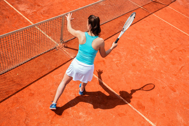 Female tennis player on the net - Фото, зображення