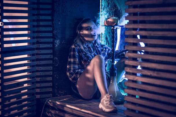 Beautiful girl smokes hookah - Фото, изображение