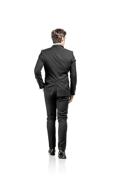 Rear view of walking businessman, isolated - Foto, imagen