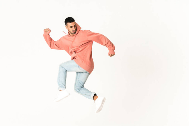 Man dancing street dance style over isolated white background - Foto, Imagem