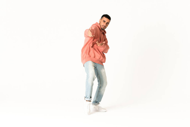 Man dancing street dance style over isolated white background - Foto, immagini
