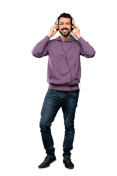 Handsome man with sweatshirt listening music - Foto, Imagen