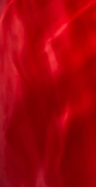 Red abstract art background, silk texture and wave lines in moti - Photo, Image