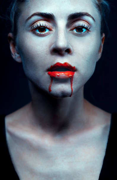 Zombie woman with bloody lips and blue skin portrait. Fashion glamour halloween art design concept - Zdjęcie, obraz