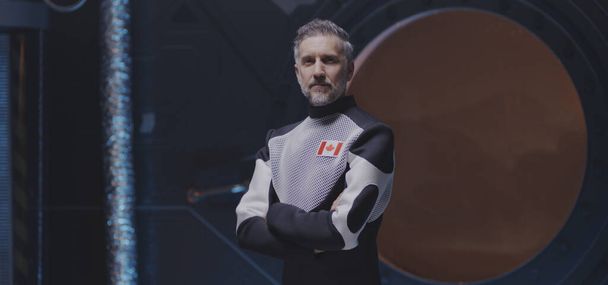 Un astronaute canadien regarde une caméra
 - Photo, image