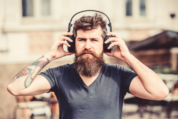 Im online. Soul music. Mature hipster with beard. Enjoying his favorite music. Time stops with nice music. Bearded man. brutal caucasian hipster with moustache. Young and brutal - Photo, Image