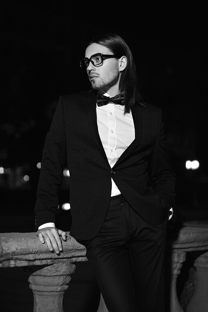 Handsome man in black costume in glasses - Фото, зображення