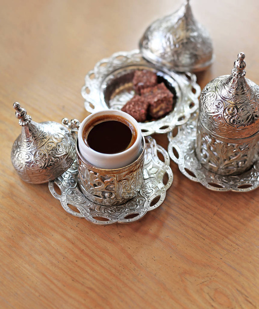 traditional turkish coffee and turkish delight on wooden table - Fotoğraf, Görsel