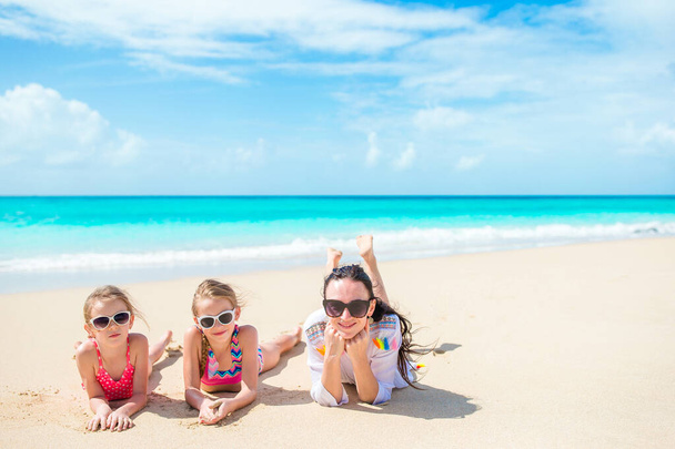Happy beautiful family on a tropical beach vacation - Fotoğraf, Görsel
