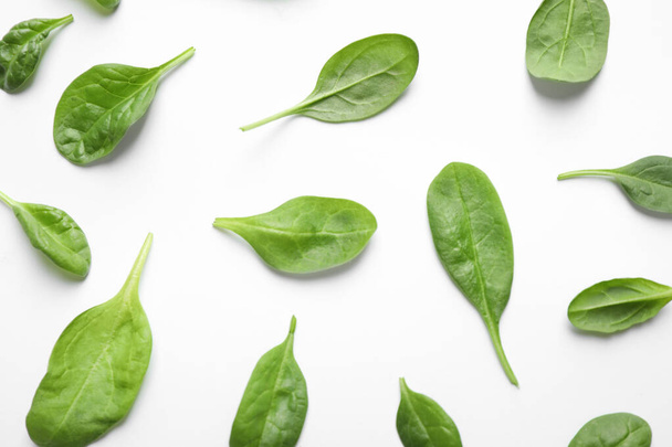 Fresh green healthy spinach leaves on white background, top view - 写真・画像