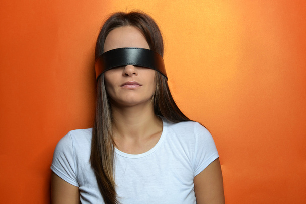 Young woman with the blindfold - Фото, изображение
