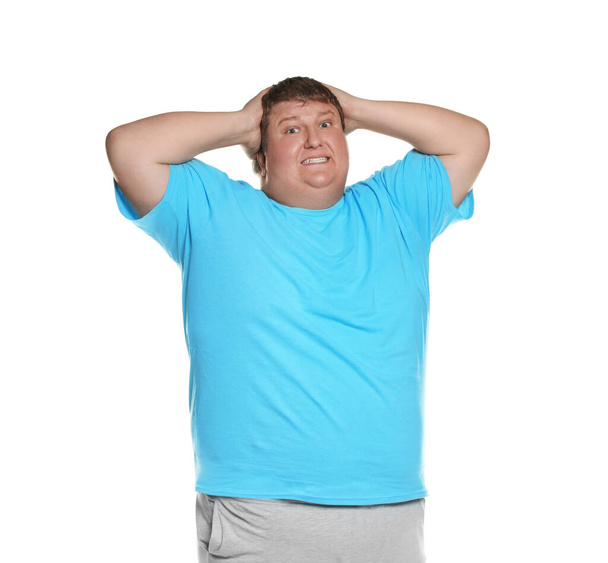 Emotional overweight man posing on white background - Foto, imagen