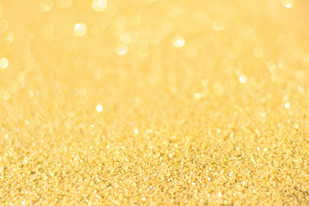 Rozostřené zlaté třpytky pozadí. Gold abstraktní bokeh backgroun - Fotografie, Obrázek
