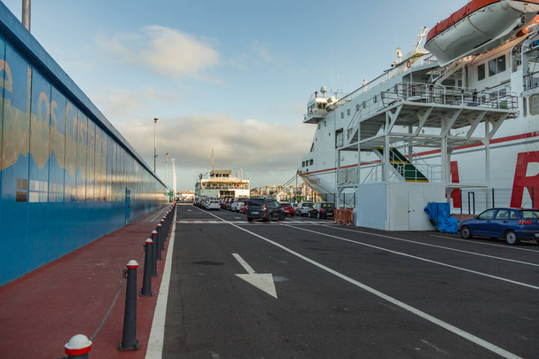 Harbor in Los Cristianos, Tenerife, Spain - May 25, 2019 - Ferry Armas to La Gomera early morning in the port of Los Cristianos docking to the harbour - Photo, Image