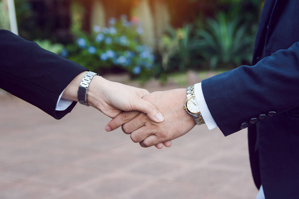 Businessman and woman shake hands after a business meeting - Zdjęcie, obraz