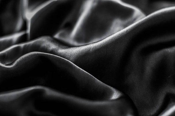 Luxury black soft silk flatlay background texture, holiday glamo - Valokuva, kuva