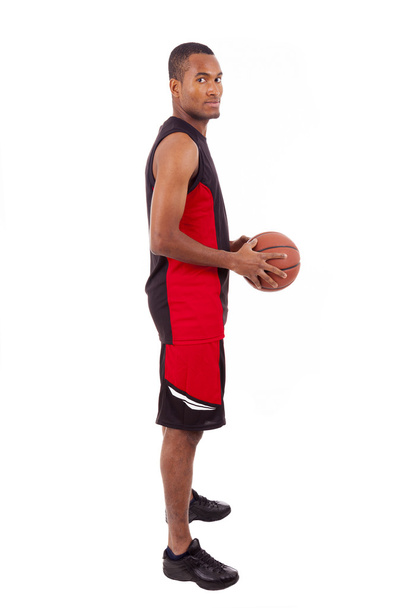 widok z boku graczem koszykówki na białym tle w tle - Zdjęcie, obraz