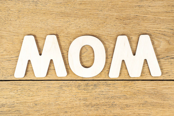 word mom from wooden letters - Foto, Bild
