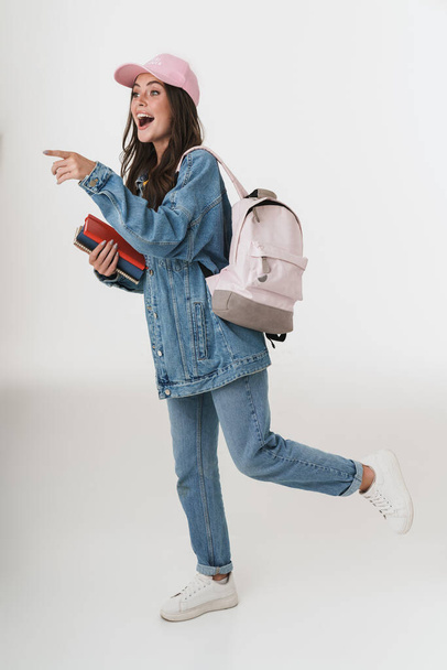 Photo of young student girl wearing denim clothes smiling and lo - Zdjęcie, obraz